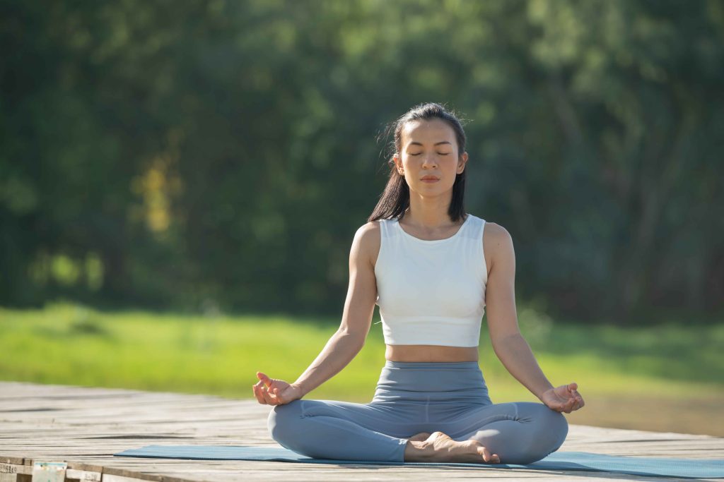 woman-yoga-mat-relax-park-mountain-lake-calm-woman-with-closed-eyes-practicing-yoga-sitting-padmasana-pose-mat-lotus-exercise-attractive-sporty-girl-sportswear_11zon
